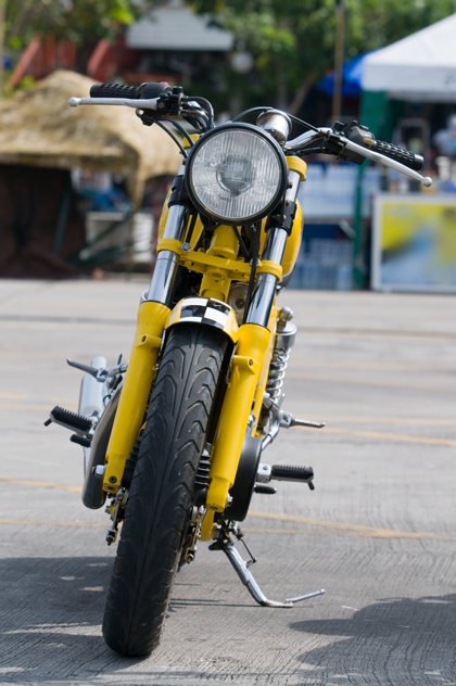 Hidden stash tubes for unobstructive motorcycle storage, shown on a classic sixties scoot.